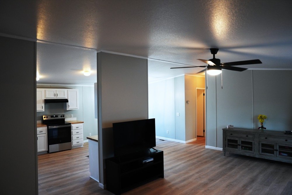 Representative open living and kitchen area of a Graham Shadows manufactured home